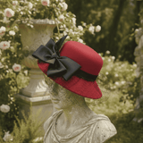 Load image into Gallery viewer, French Elegant Hats | Vibrant Red Wool Cloche Hat With Large Black Satin Bow &amp; Delicate Birdcage Netting Veil