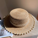 Load image into Gallery viewer, Spring and summer Korean version handmade pearl straw woven flat top hat wheat straw straw hat versatile flat edge hat seaside sun protection hat