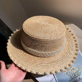 Load image into Gallery viewer, Spring and summer Korean version handmade pearl straw woven flat top hat wheat straw straw hat versatile flat edge hat seaside sun protection hat