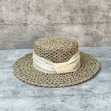 Load image into Gallery viewer, Blogger with the same silk and linen decoration French seaside vacation straw hat women's summer salty straw woven hollow flat top sunshade hat