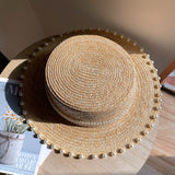 Load image into Gallery viewer, Spring and summer Korean version handmade pearl straw woven flat top hat wheat straw straw hat versatile flat edge hat seaside sun protection hat