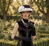 Load image into Gallery viewer, icevellyyy black and white felt fascinator hat with white floral embellishment and pearl accents, wide brim.