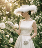 Load image into Gallery viewer, icevellyyy elegant white satin bridal hat with feather trim and pearls, paired with a matching gown and gloves.