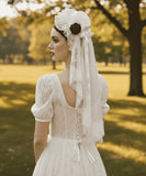 Load image into Gallery viewer, icevellyyy white lace wedding dress with puff sleeves and lace-up back, paired with a matching veil.